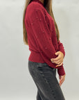 Maglione con perle applicate