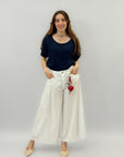 Pantaloni wide leg con charm