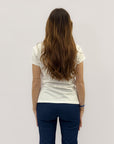 T-shirt con scritta "non andare, rimani"