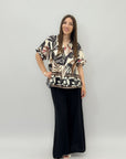 Completo maglia con fiori e pantalone taglia comoda