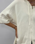 Cardigan donna con cappuccio, zip e fondo asimmetrico