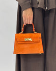 Mini bag a mano in vera pelle scamosciata con chiusura gioiello