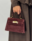 Mini bag a mano in vera pelle scamosciata con chiusura gioiello