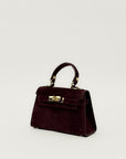 Mini bag a mano in vera pelle scamosciata con chiusura gioiello