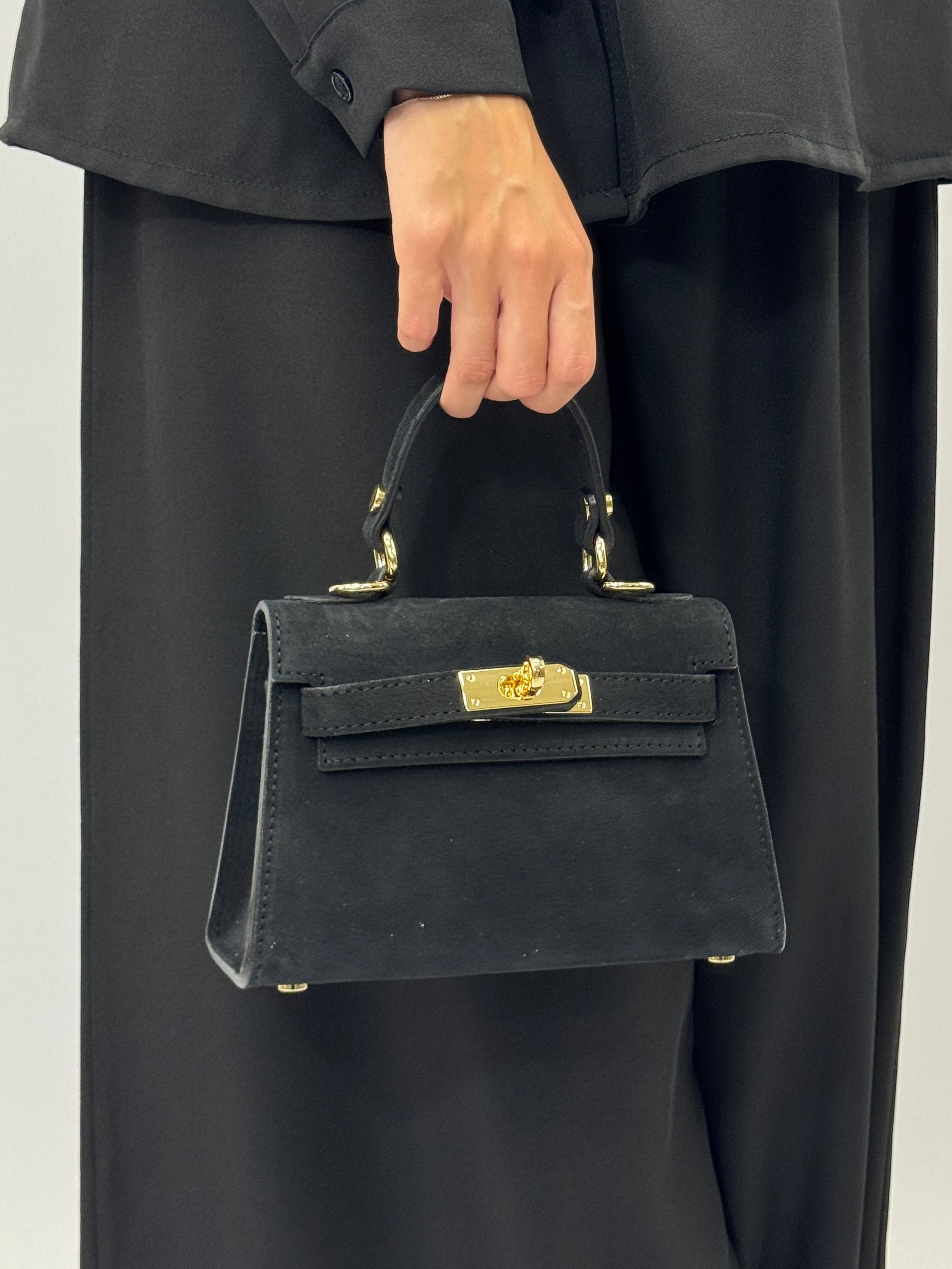 Mini bag a mano in vera pelle scamosciata con chiusura gioiello