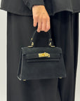 Mini bag a mano in vera pelle scamosciata con chiusura gioiello