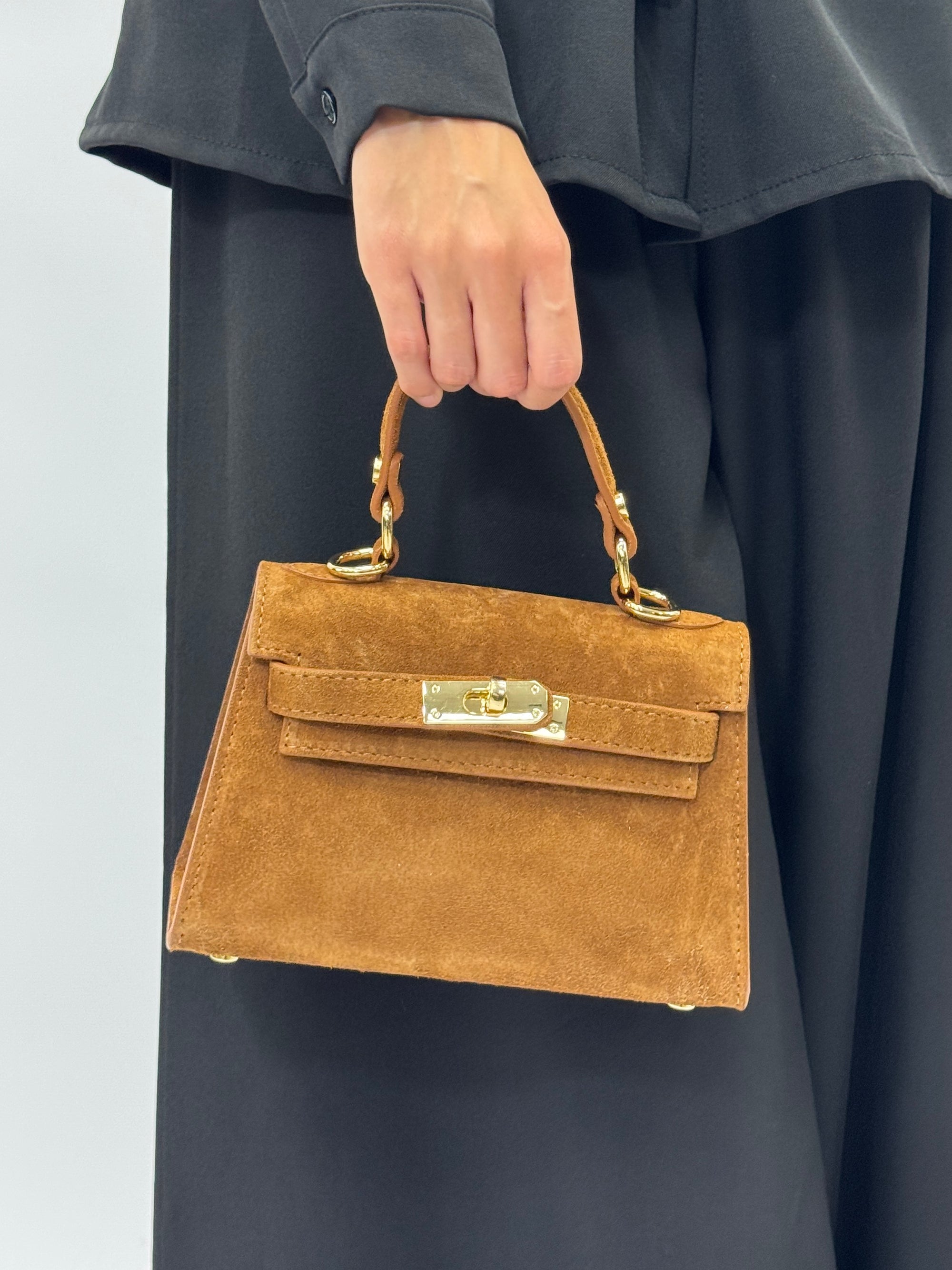 Mini bag a mano in vera pelle scamosciata con chiusura gioiello