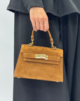 Mini bag a mano in vera pelle scamosciata con chiusura gioiello