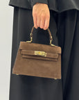 Mini bag a mano in vera pelle scamosciata con chiusura gioiello