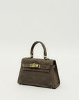 Mini bag a mano in vera pelle scamosciata con chiusura gioiello