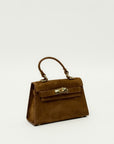 Mini bag a mano in vera pelle scamosciata con chiusura gioiello