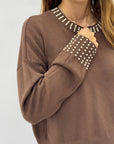 Maglione grigio con applicazioni gioiello – Girocollo e polsini decorati