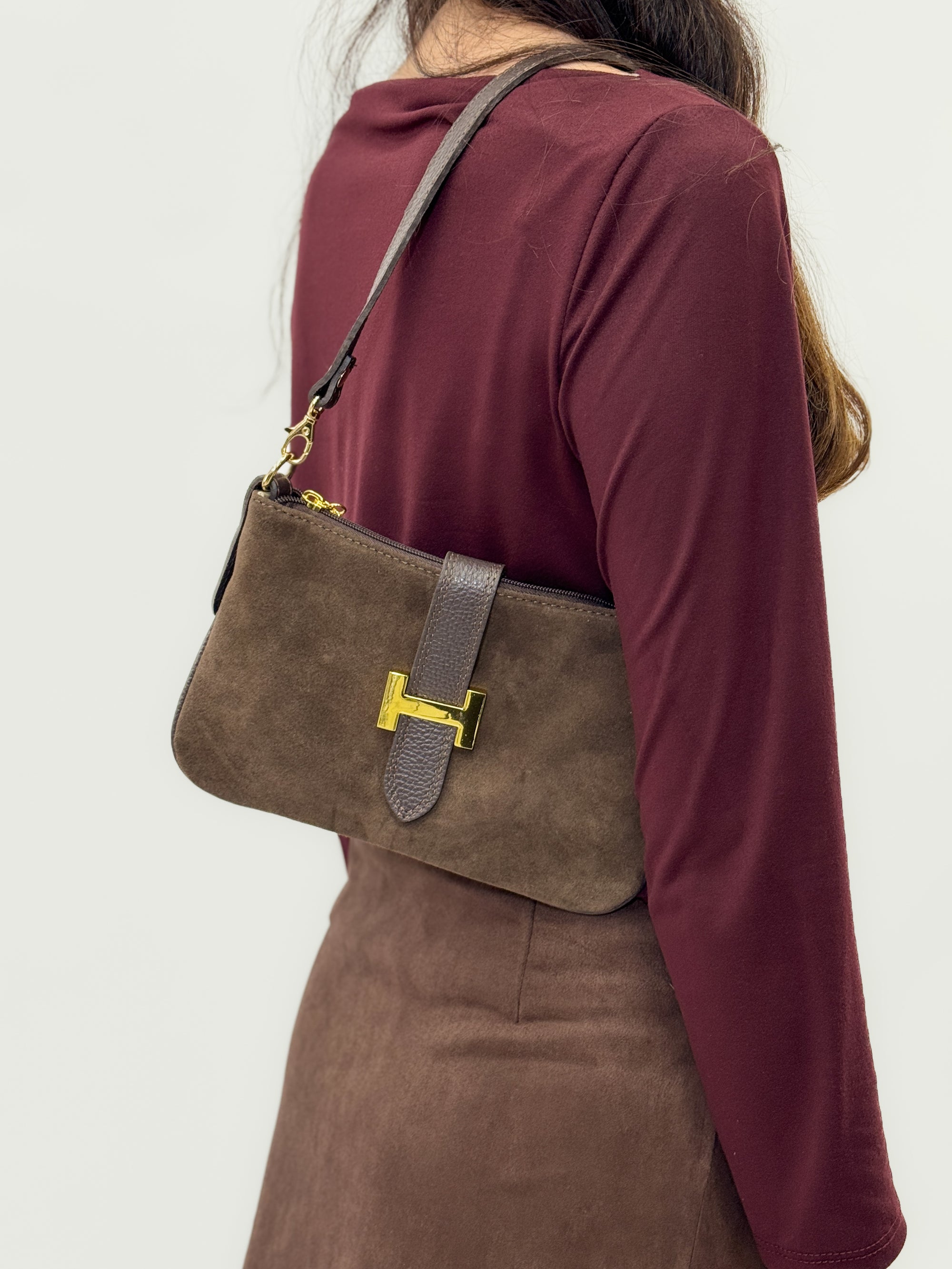 Borsa in vera pelle con fibbia H dorata