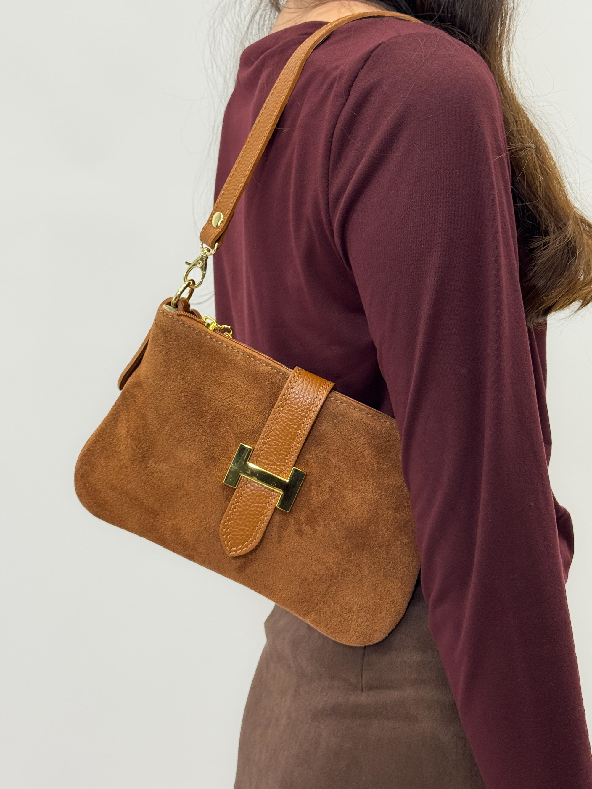 Borsa in vera pelle con fibbia H dorata