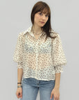 Camicia in chiffon a pois con maniche a sbuffo