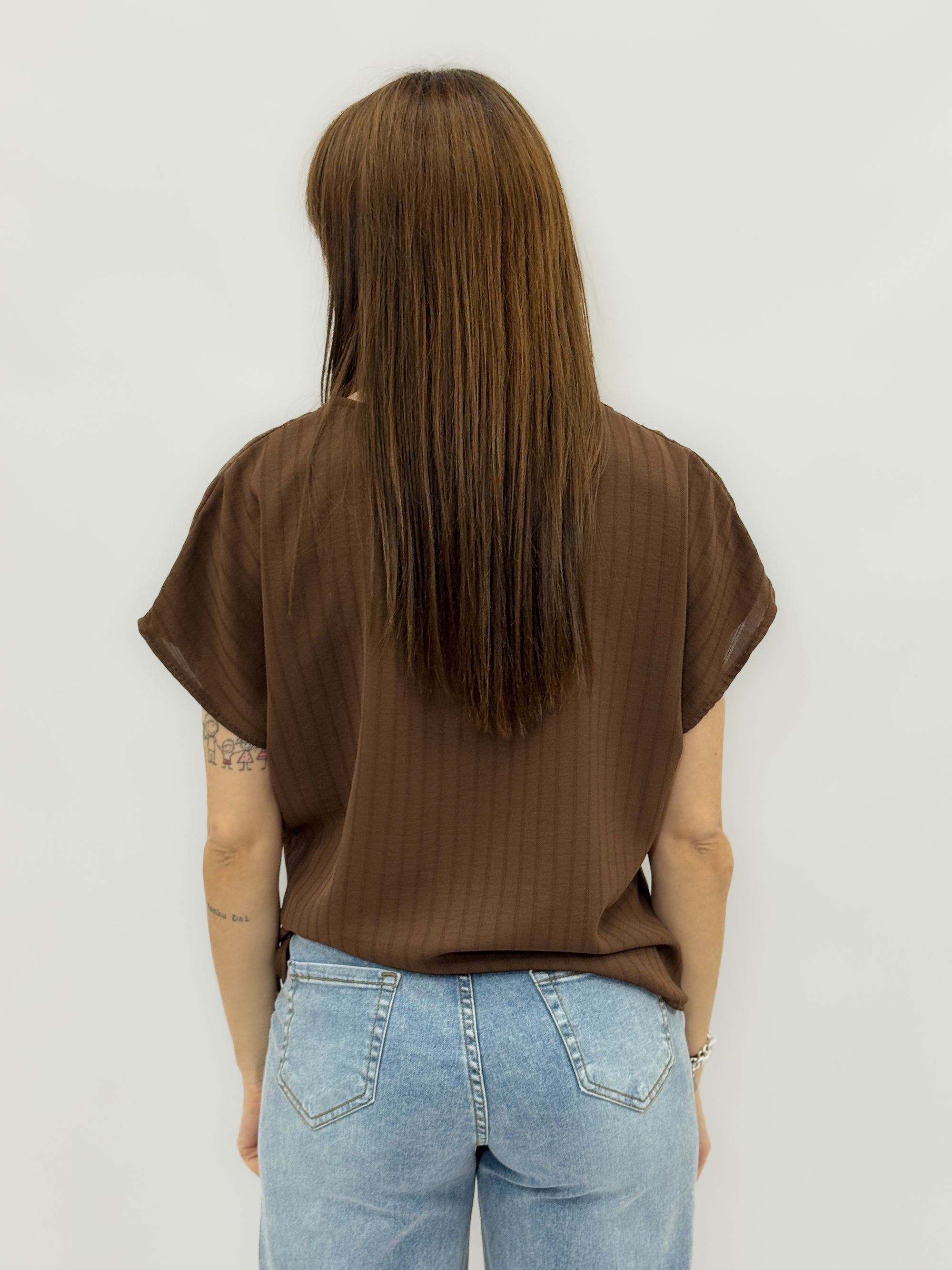 Blusa a righe con nodo laterale