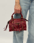 Borsa a mano con dettagli borchiati