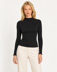 Maglia donna nero a costine con collo alto e punti luce indossata da Polly 7, vista frontale