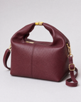 Borsa mini con manico annodato in vera pelle – Bordeaux, vista a tre quarti