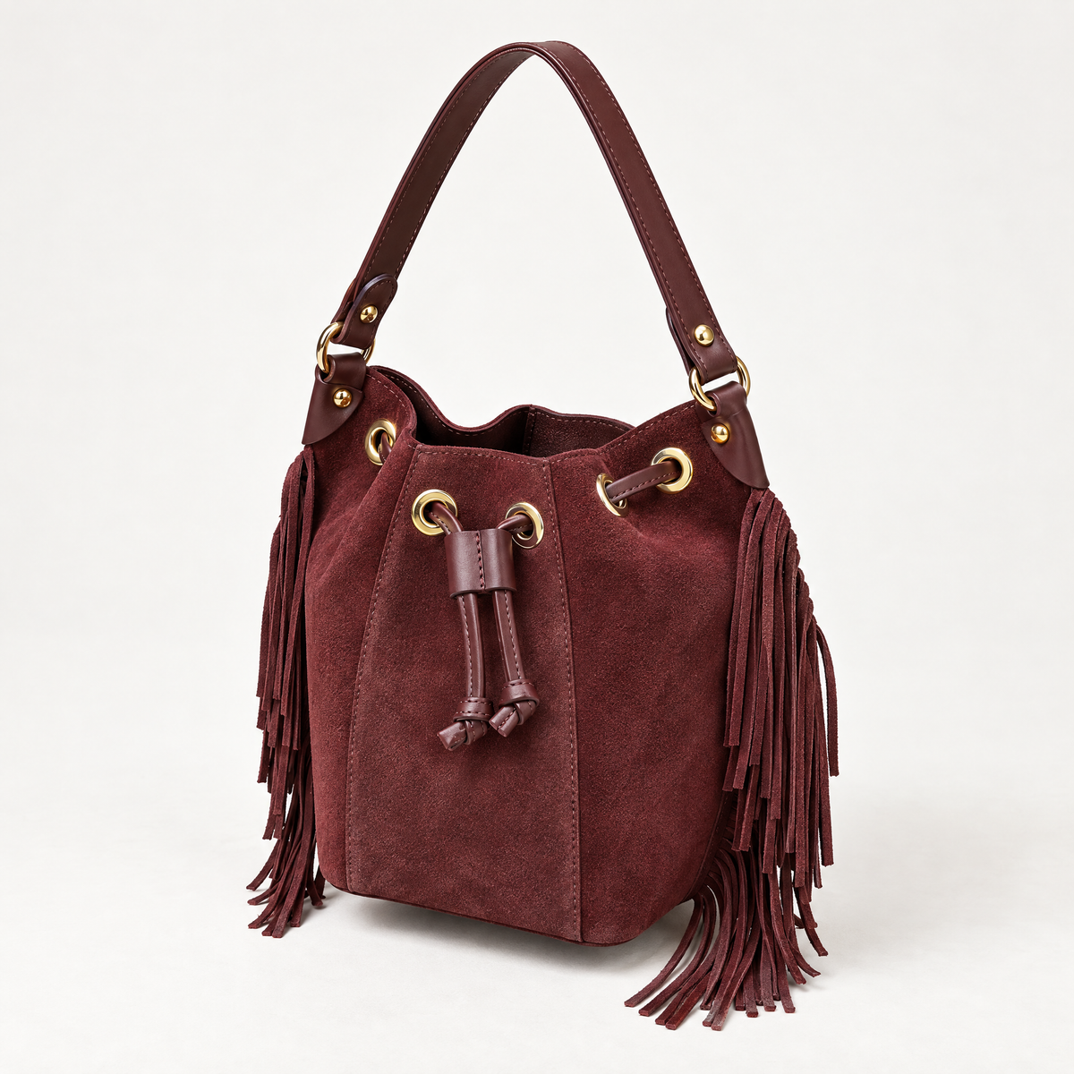Borsa secchiello in vera pelle scamosciata bordeaux con frange - vista tre quarti