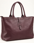 Borsa shopper in vera pelle martellata bordeaux con doppi manici – vista a tre quarti