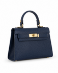 Mini bag a mano in vera pelle blu, seconda vista su sfondo bianco