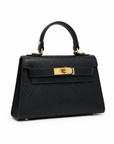 Mini bag a mano in vera pelle nera, vista frontale su sfondo bianco