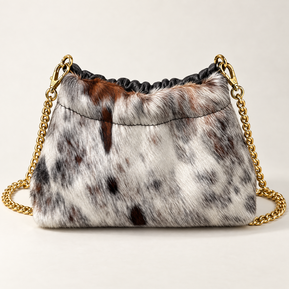 Mini borsa in vera pelle maculata con catena dorata, vista frontale maculata