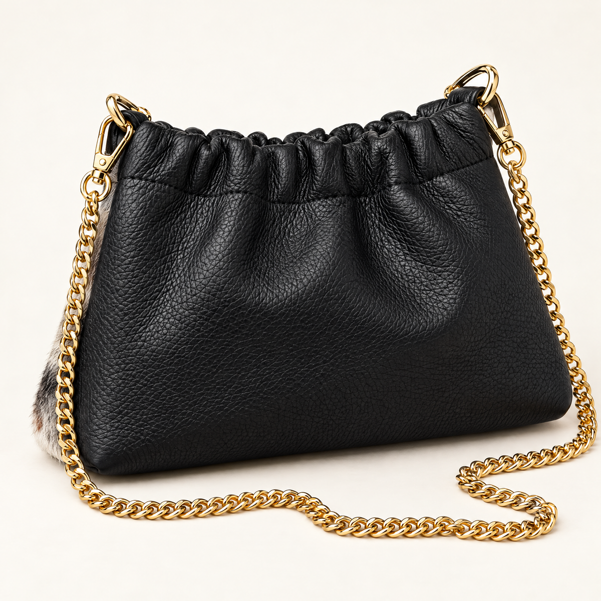 Mini borsa in vera pelle maculata con catena dorata, retro in pelle nera